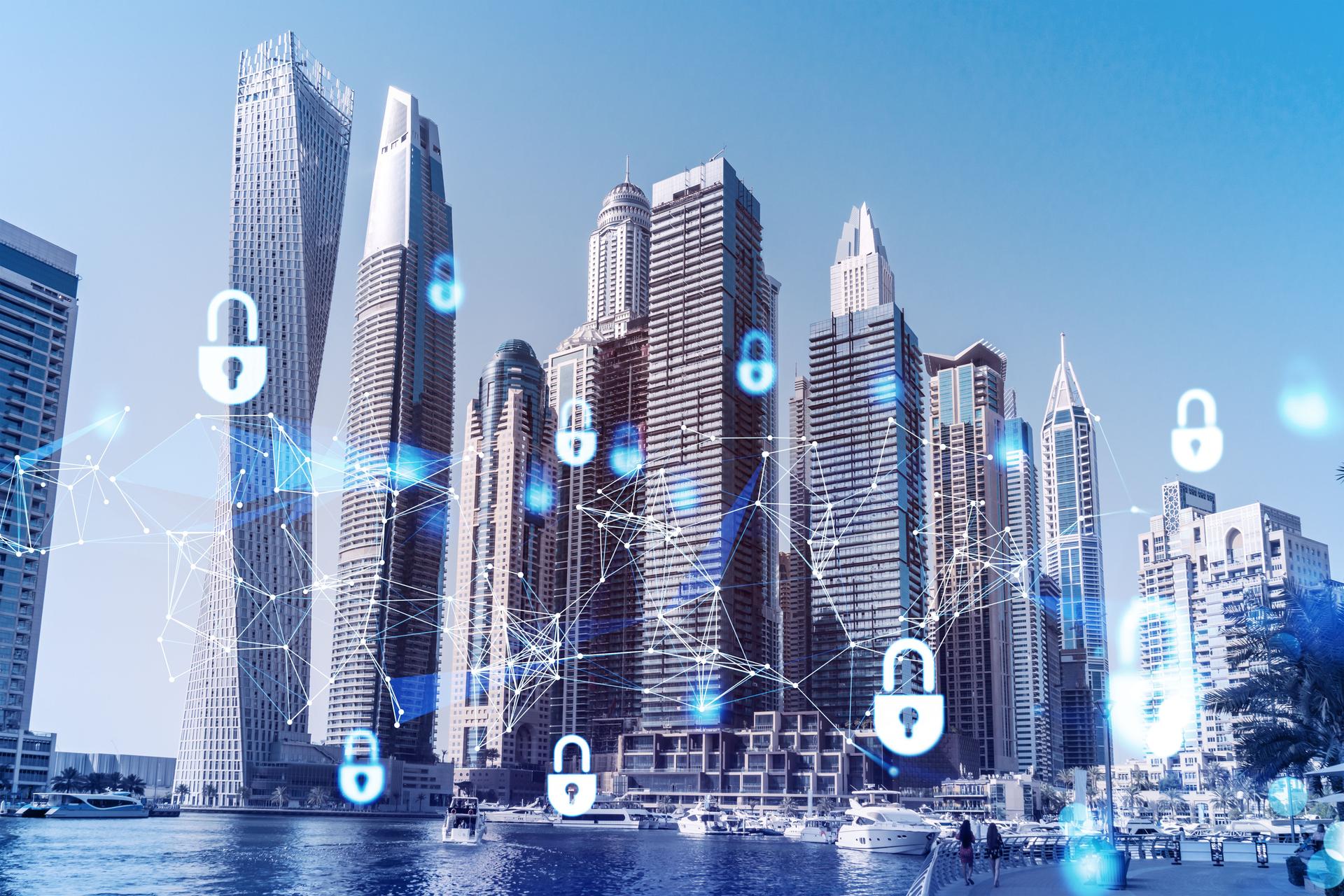 Skyscrapers of Dubai business downtown. International hub of trading and financial services. Lock icon hologram, concept of datum security. Double exposure. Dubai Canal waterfront.